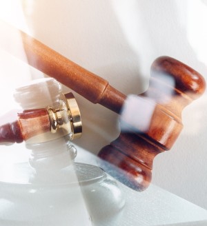 A judge's gavel on a white background.