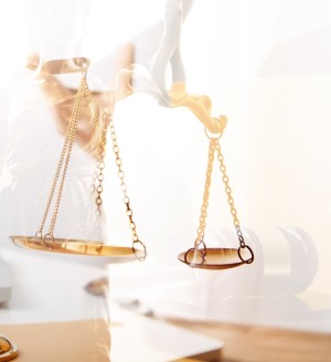 A photo of justice scales and a judge's gavel.